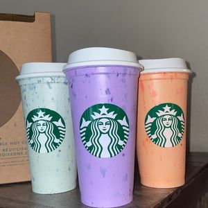 Starbucks reusable hot cups with lids.